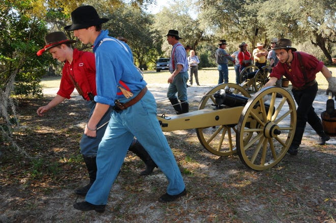 Tommy Townsend and Tyler Mann pull a cannon out of the way following a practice drill last year at the Battle of Townsend's Plantation and Civil War Festival hosted on the open fields of Renninger's Mount Dora Flea Market and Antique Center.