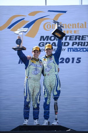 Liam Dwyer, left, joins co-driver Andrew Carbonell in Victory Lane after winning a Continental Challenge race last May in Monterey, California. Dwyer and Carbonell will race the No. 26 Mazda in Friday's BMW Performance 200 at Daytona International Speedway. LAT PHOTO USA/RICHARD DOLE