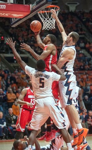 Ohio State forward Keita Bates-Diop (33) puts up a shot between Illinois guard Jalen Coleman-Lands (5) and Illinois center Maverick Morgan (22) in overtime of an NCAA College basketball game at the State Farm Center in Champaign, Ill., Thursday Jan. 28, 2016. Ohio State won 68-63.