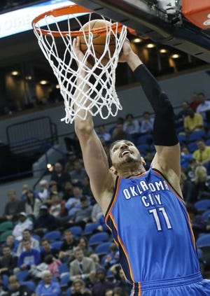 Enes Kanter dunks en route to a 23-point game Wednesday night. (AP Photo)