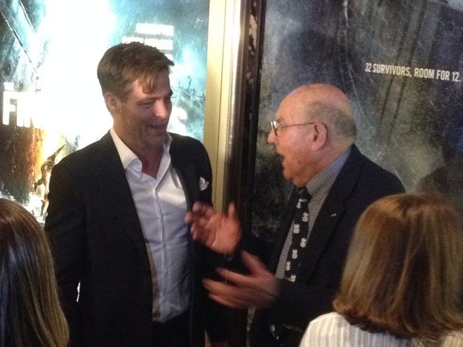 Actor Chris Pine talks with Mel "Gus" Gouthro, a retired Coast Guard engineer who was stationed in Chatham in 1952, at Thursday night's Boston premiere of "The Finest Hours."