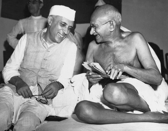 Mahatma Gandhi, right, with Jawaharlal Nehru, who would become India's first prime minister, at an All-India Congress committee meeting in Bombay in 1946. AP/Max Desfor