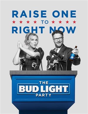 This image provided by Anheuser-Busch shows actors Amy Schumer and Seth Rogen in the company's Bud Light ad for Super Bowl 50. (Anheuser-Busch via AP)