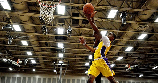 Montverde's Devontae Jordan (2) goes for a layup during a game against Jacksonville Providence on the second day of the Montverde Academy Invitational Tournament at Montverde Academy on Friday. Montverde beat Jacksonville Providence 88-51.