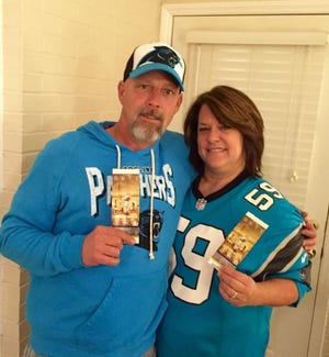 Greg and Tracy Harkey are both longtime Panther fans who won a drawing among season ticket holders, making them eligible to buy Super Bowl tickets. After some negotiations between brothers, Greg could finally tell his wife he was taking her to Super Bowl 50. The image of the ticket was blurred as a security measure to prevent counterfeiting.