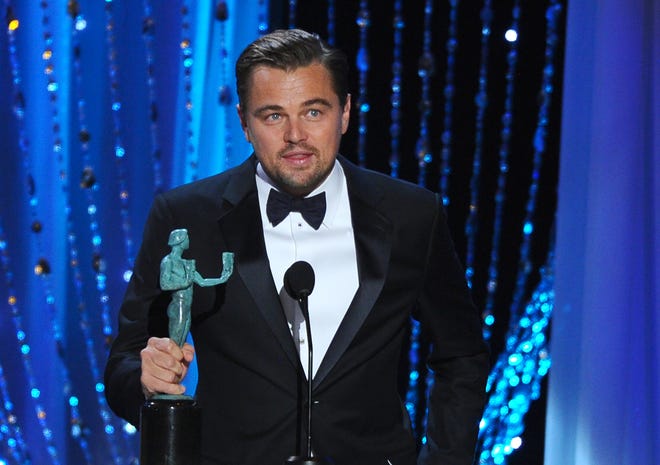 Leonardo DiCaprio accepts the award for outstanding male actor in a leading role for "The Revenant" at the 22nd annual Screen Actors Guild Awards at the Shrine Auditorium & Expo Hall on Saturday, Jan. 30, 2016, in Los Angeles. (Photo by Vince Bucci/Invision/AP)