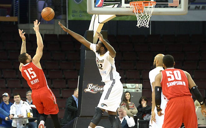 Nnanna Egwu of the Erie BayHawks blocks the shot of Davion Berry of the Maine Red Claws in the NBA D-League game Jan. 29 at Erie Insurance Arena. (AP Photo/Erie Times-News, Jack Hanrahan)