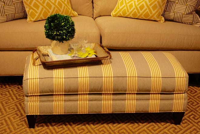 Gray is at its best when paired with yellows. This ottoman is covered with a simple gray and yellow stripe. 

TNS