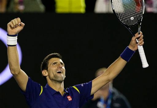 Novak Djokovic of Serbia celebrates after defeating Andy Murray of Britain in the men's singles final at the Australian Open tennis championships in Melbourne, Australia, Saturday, Jan. 30, 2016.(AP Photo/Aaron Favila)