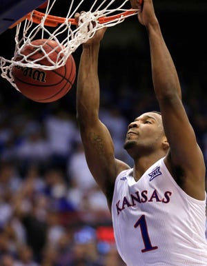 Kansas guard Wayne Selden Jr. (1) dunks during the first half of an NCAA college basketball game against Kentucky in Lawrence, Kan., Saturday, Jan. 30, 2016. (AP Photo/Orlin Wagner)