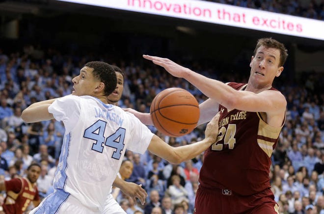 North Carolina's Justin Jackson (44) and Boston College's Dennis Clifford (24) reach for a rebound during the second half of an NCAA college basketball game in Chapel Hill, N.C., Saturday, Jan. 30, 2016. North Carolina won 89-62. (AP Photo/Gerry Broome)