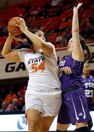 Oklahoma State's Kaylee Jensen (54) looks to score against TCU's Claire Ferguson (44) during a women's college basketball game between the Oklahoma State Cowgirls (OSU) and the TCU Horned Frogs at Gallagher-Iba Arena in Oklahoma City, Saturday, Jan. 30, 2016. Photo by Nate Billings, The Oklahoman