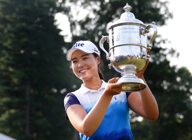 South Korea's In Gee Chun holds up the championship trophy last July after winning the U.S. Women's Open in Lancaster, Pa.