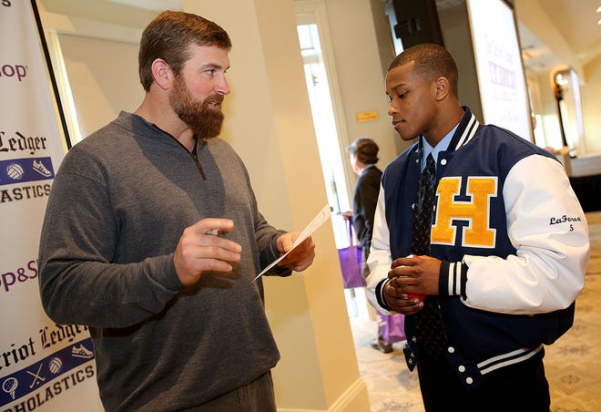 Matt Light, a three-time Super Bowl champion with the New England Patriots, with Patriot Ledger All-Scholastic Dimitry LaForest of Hanover High School, at the All-Scholastic banquet on Sunday, Jan. 31, 2016, at the Granite Links Golf Club in Quincy.
