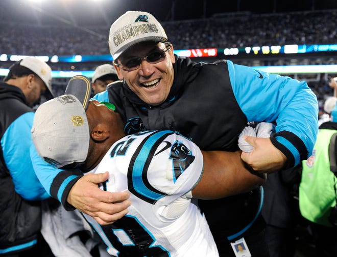 Carolina Panthers head coach Ron Rivera celebrates with Jonathan Stewart after the Panthers beat the Arizona Cardinals in the NFC Championship, 49-15, last weekend in Charlotte, N.C. Photo by AP