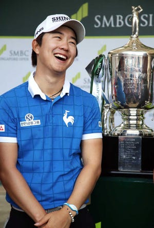 Song Younghan smiles during an interview after winning the SMBC Singapore Open golf tournament at Sentosa Golf Club's Serapong Course on Monday, Feb. 1, 2016, in Singapore. (AP Photo/Wong Maye-E)
