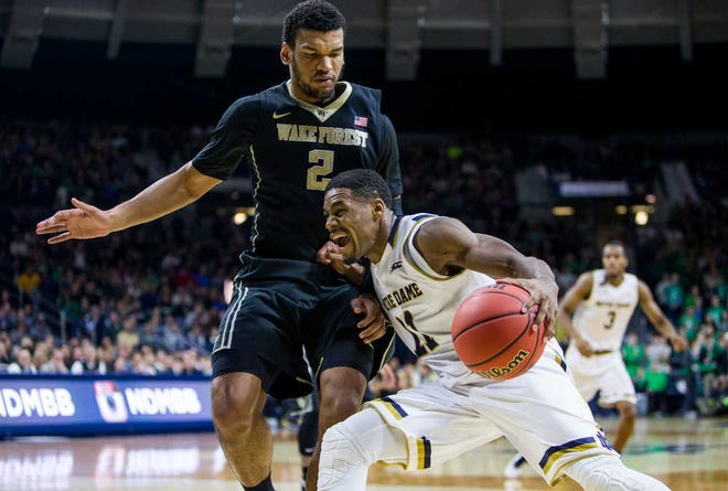 Notre Dame's Demetrius Jackson (11) drives by Wake Forest's Devin Thomas (2) during the second half of an NCAA college basketball game Sunday, Jan. 31, 2016, in South Bend, Ind. (AP Photo/Robert Franklin)