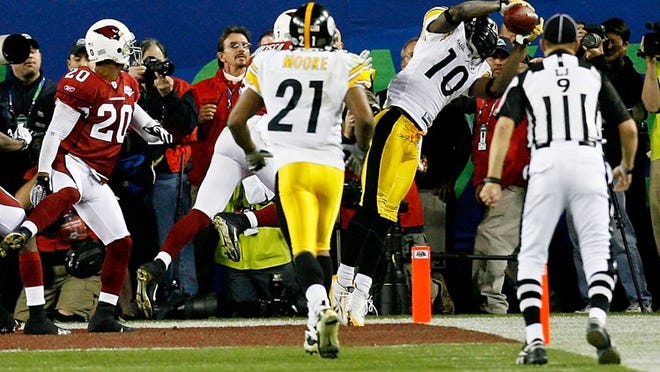 Santonio Holmes (10) of the Pittsburgh Steelers, a Glades Central High graduate, catches a 6-yard game-winning touchdown pass in the closing seconds of the game against the Arizona Cardinals during Super Bowl XLIII on February 1, 2009 at Raymond James Stadium in Tampa, Florida. The Steelers won the game by a score of 27-23. (Photo by Kevin C. Cox/Getty Images)