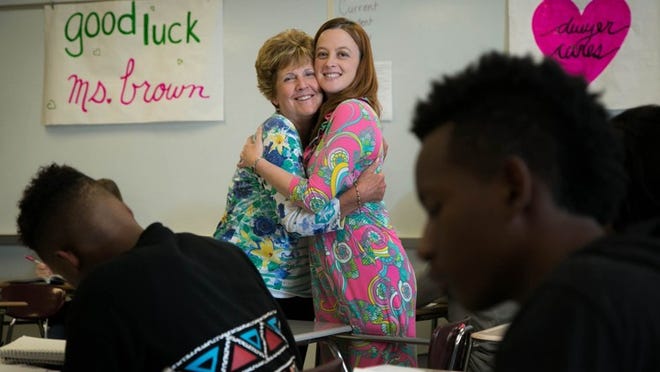 Jane Brown hugs her daughter, Jennifer Brown at Dwyer High School in Palm Beach Gardens, Florida on February 1, 2016. Jennifer Brown, an English teacher at Dwyer High School, was diagnosed with ovarian cancer Aug. 19. She was worried about how her 10th grade students will pass the FSA with a teacher who misses a lot of class because of her health. Brown’s mom, Jane Brown, who taught in the district for 27 years, stepped up to be her sub. She comes in as a volunteer and helps on Brown’s bad days. (Allen Eyestone / The Palm Beach Post)