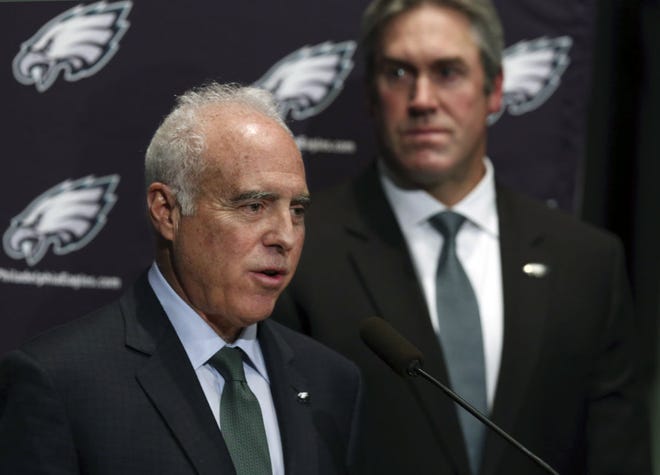 Philadelphia Eagles owner Jeffrey Lurie, left, isn't expected to hire a personnel director until after the draft at the earliest.