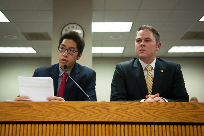 University of Missouri journalism student Tim Tai, left, testifies Monday next to state Rep. Elijah Haahr, R-Springfield, before the Emerging Issues Committee during a hearing about the Cronkite New Voices Act at the Missouri Capitol in Jefferson City. Tai was caught on camera in a confrontation with protesters Nov. 9 while covering events on the Carnahan Quadrangle.