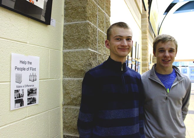 Hamilton High School senior Zach Tomlinson, 18, and junior Caleb Topp, 16, started a bottled water drive for Flint residents Monday, Feb. 1, 2016, at their school. Amy Biolchini/Sentinel Staff