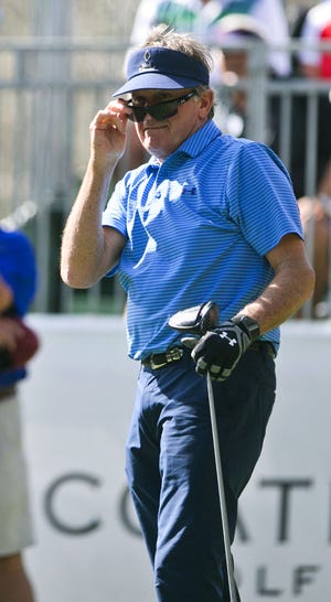 Former head coach Steve Spurrier takes another look at where his ball lands after he tees off of one during the Pro-Am golf day of the Coates Golf Championship presented by R+L Carriers on Tuesday at Golden Ocala.