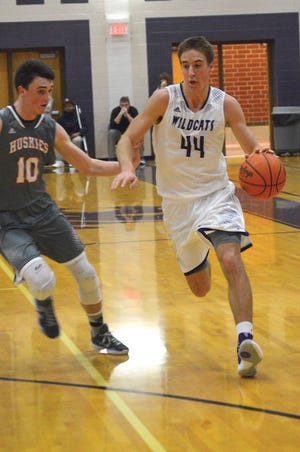 Adam Reed of Three Rivers pushes the ball up the floor against Portage Northern on Tuesday.