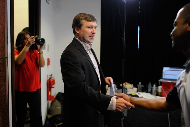 Georgia head coach Kirby Smart makes his way toward a stage for an interview during National Signing Day at Butts-Mehre Heritage Hall on Wednesday, Feb. 3, 2016, in Athens, Ga. (AJ Reynolds/Staff, @ajreynoldsphoto)