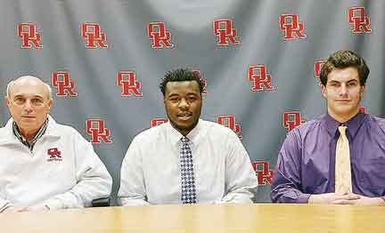 Oak Ridge High School head football coach Joe Gaddis, from left, is pictured on Feb. 3, 2016, with Darel Middleton who has signed to play football with Mississippi Gulf Coast Community College and Alex Alcorn who has signed to play football with Tennessee Tech.