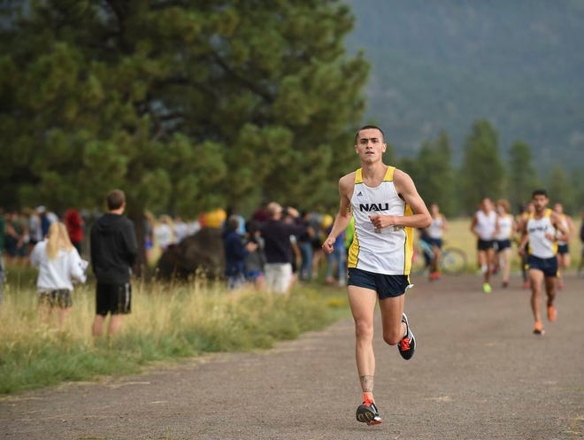 St. Thomas Aquinas graduate Cory Glines, shown running a cross county meet, is making an impact with the Northern Arizona indoor track team.