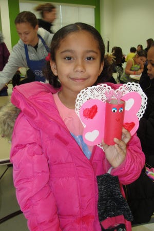 Kaelyn Sutherland, 6, shows off the valentine she made at the Discovery Center's Chocolate Sundae Sunday event in 2015. PHOTO PROVIDED