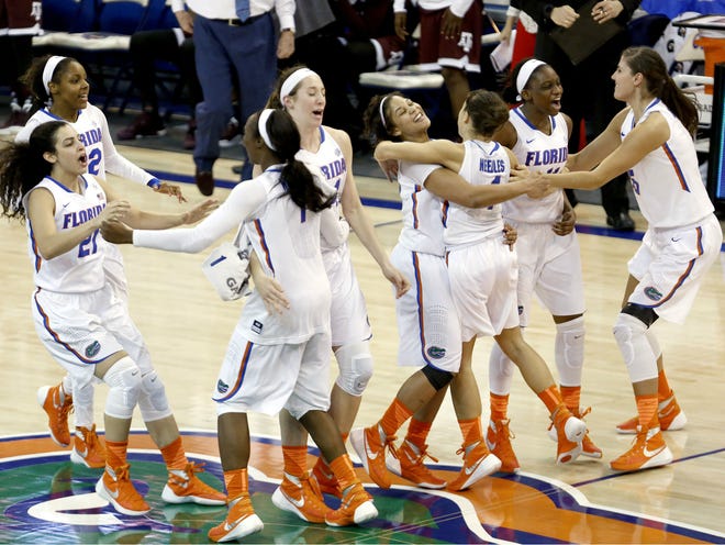 The Florida Gators celebrate after beating the Texas A&M Aggies 83-81. The win was Florida's fourth over a ranked opponent this season.