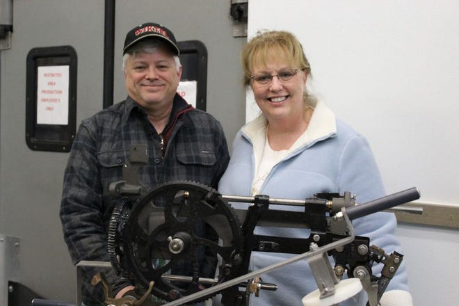 Malcom and Theresa Oatman are the Pro-PIE-etors of Lake of the Woods Pie Company which is located in a portion of the former Pugsley Sandwich factory along Highway 57 south. They pose here with their unique apple coring, peeling and slicing machine.