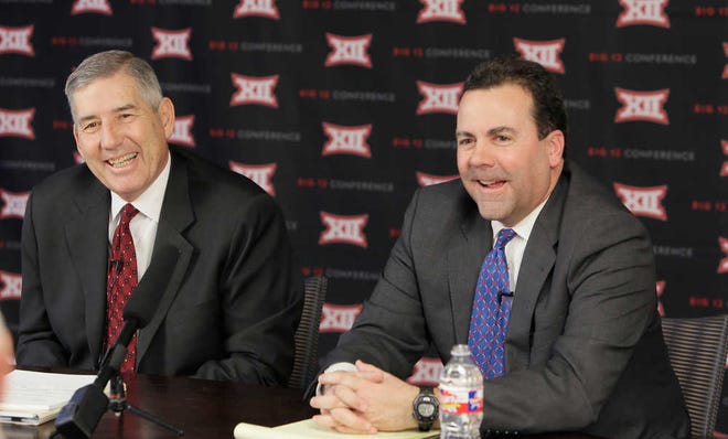 Big 12 commissioner Bob Bowlsby, left, and Kansas athletic director Sheahon Zenger laugh while taking reporter's questions after the first day of the conference's meeting Thursday, Feb. 4, 2016, in Irving, Texas. (AP Photo/LM Otero)