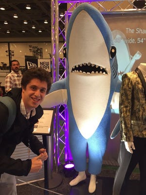 Gazette sports editor Jack Flagler poses for a photo with the real star of Super Bowl week, Left Shark.
