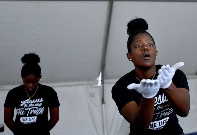 From left, twin sisters Alisa and Leah Mose, 15, perform at the Tavares African American Heritage Festival at Wooton Park on Saturday in Tavares. This is the first of a number of black history month activities slated to occur in Lake County during February.
