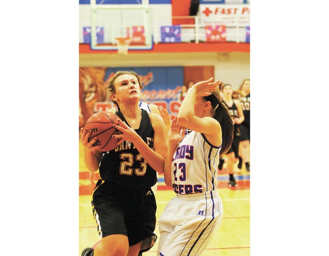 Santa Fe's Katie Muston (23) drives to the hoop against Mt. Pleasant's Alexia Angus (23) on Friday in Mt. Pleasant. (Photo by correspondent Rob Fleming)