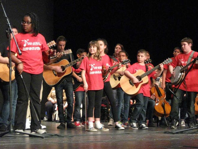 Photos by Teresa.Stepzinski@jacksonville.com The Cherry Pickers, a student bluegrass band from W.E. Cherry Elementary School, perform live at the Clay County Teacher of the Year and School-Related Employee of the Year celebration Feb. 2 at the Thrasher-Horne Center for the Arts in Orange Park.