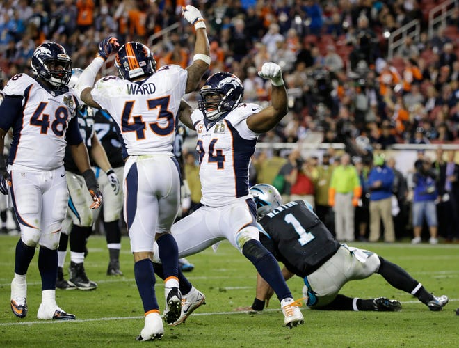 Denver Broncos defensive lineman DeMarcus Ware (94) celebrates after sacking Carolina Panthers quarterback Cam Newton (1) with Shaquil Barrett (48) and T.J. Ward (43) during the second half of Super Bowl 50 Sunday in Santa Clara, Calif. Photo by AP