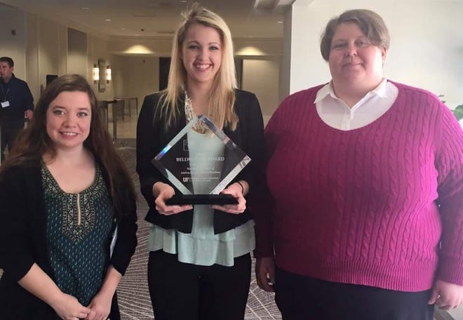 Gaston College SPARC3 scholars, from left, Janna Stover, Madison Staves and Chelsey King, pose with the Bellwether Award in Orlando, Fla., on Jan. 26. The three students presented to a panel of judges the previous day how the SPARC3 program at Gaston College in Dallas has impacted their lives.