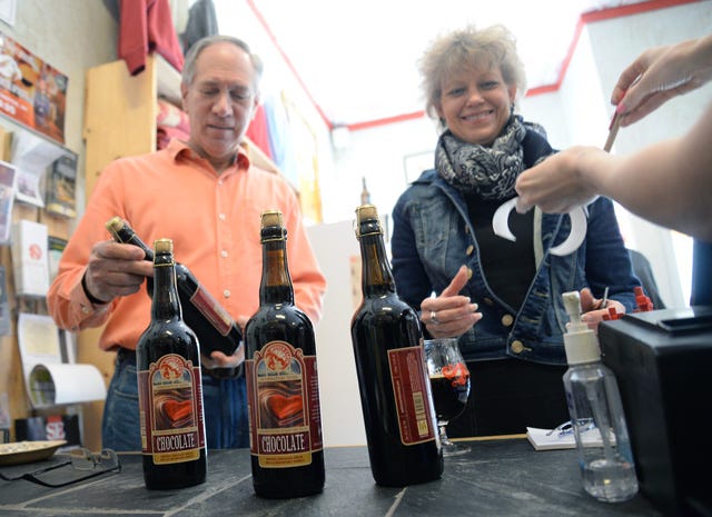 Frank and Karla Werner, of Clayton, traveled to Kinston on Saturday to visit Mother Earth Brewing and purchase some of the first bottles of the newly released Windowpane Series Chocolate.