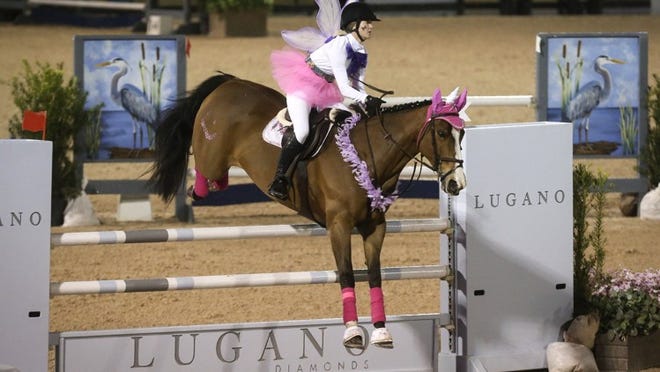 A member of the Habilitation Center for the Handicapped’s team competes in the 7th Annual Great Charity Challenge at the Palm Beach International Equestrian Center Saturday, February 6, 2016. Contestants dressed up as their favorite prince or princess characters. The Challenge was founded by Mark Bellissimo and his daughter Paige in 2010 as a way for the equestrian community to give back to Palm Beach County. Since then, the GCC has distributed over $7.5 million to more than 150 charities. (Bruce R. Bennett / The Palm Beach Post)