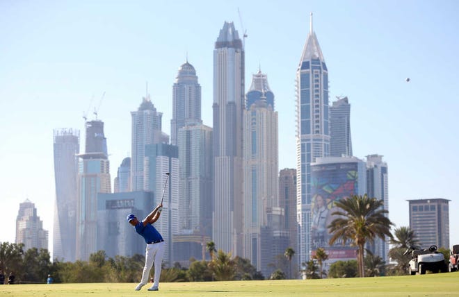 Danny Willett of England plays a shot on the 13th hole during final round of the Dubai Desert Classic golf tournament in Dubai, United Arab Emirates, Sunday, Feb. 7, 2016. (AP Photo/Kamran Jebreili)