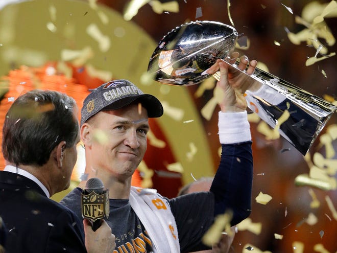 Denver Broncos'­ Peyton Manning holds the Lombardi Trophy after the NFL Super Bowl 50 football game against the Carolina Panthers, Sunday, Feb. 7, 2016, in Santa Clara, Calif. The Broncos defeated the Panthers 24-10.