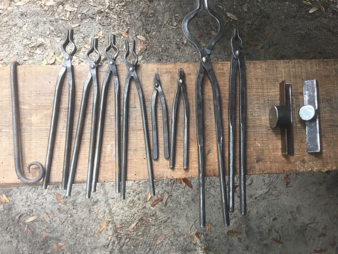 Steve Estenson sells a wide range of blacksmithing tools online, from tongs of every size to forms, shown on the far right, to bend hot steel into gentle scrolls and spirals.