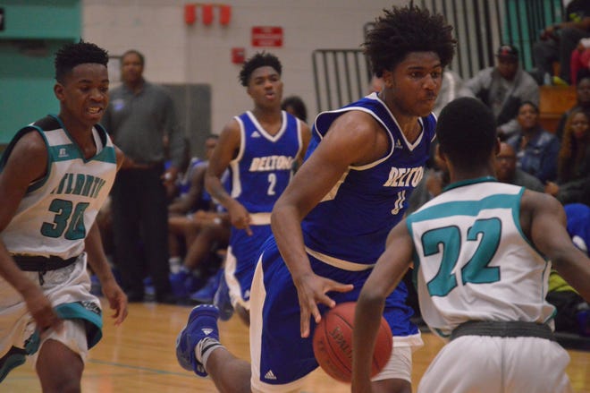 Deltona's Blake Hinson, with ball, tries to get to the hoop on a fast break against Atlantic on Saturday. Atlantic defeated Deltona for the second time this season to win the District 5-6A title. News-Journal/BRIAN LINDER