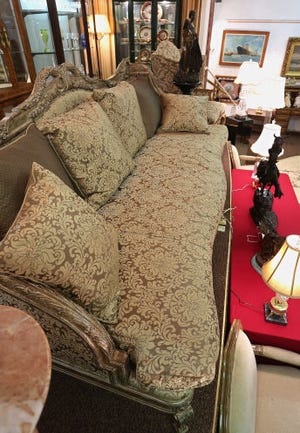 A living room sofa, center, and chairs owned by the late Tampa organized crime boss Santo Trafficante Jr., were up for auction Saturday at Joseph's Gallery in St. Petersburg. SCOTT KEELER/TAMPA BAY TIMES