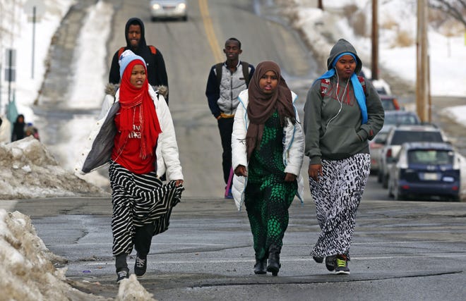 Students walk home from school in Lewiston, Maine. Since February 2000, more than 5,000 Africans have come to Lewiston, a city of 36,500. Fifteen years later, though, Somali shops, restaurants and mosques serve as an example of how far the city of Lewiston has come. AP Photo/Robert F. Bukaty