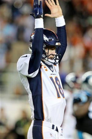 Denver QB Peyton Manning celebrates a TD pass in the fourth quarter against the Carolina Panthers during Super Bowl 50 Sunday in Santa Clara, Calif. AP photo